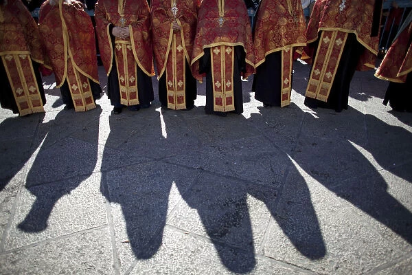 Members of the clergy wait for the Eastern Orthodox Christmas procession in Bethlehem