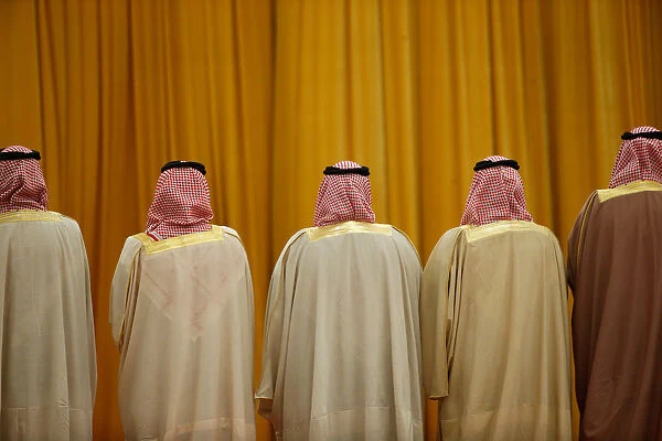 Members of the Saudi delegation wait for the arrival of Chinas President Xi Jinping