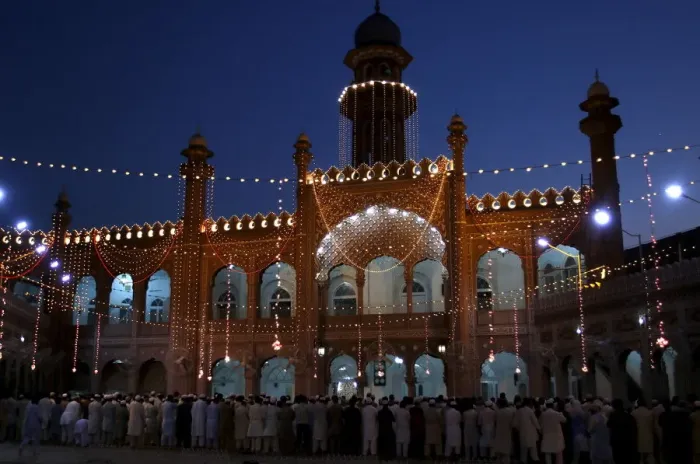 Framed Print : Men attend evening prayers during the last week of the Muslim fasting month of Ramadan Framed Print : Men attend evening prayers during the last week of the Muslim fasting month of Ramadan