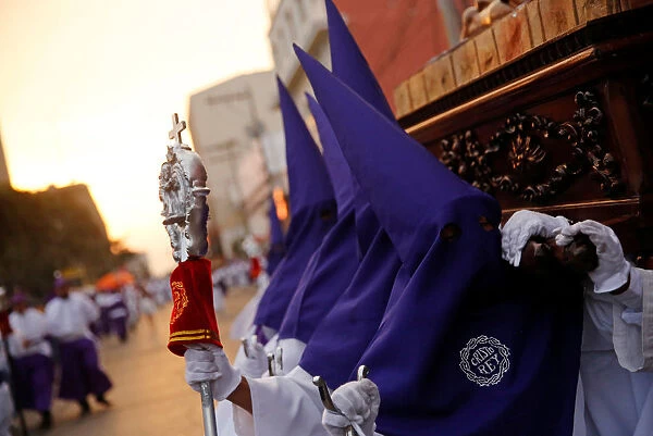 Men carry religious images during the Procession of Jesus Nazareno de Candelaria in the