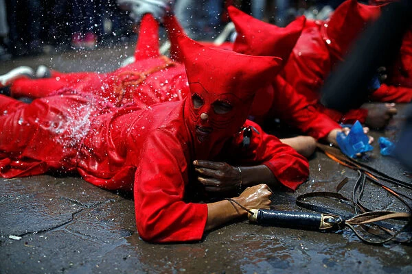 Men dressed as demons participate in a ceremony known as Los Talciguines