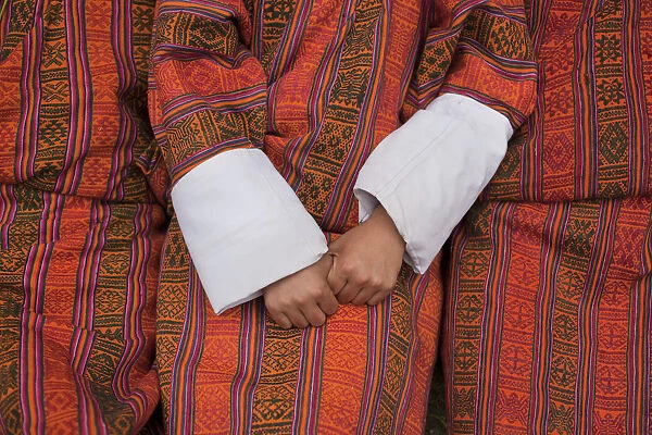 Men are seen wearing the gho, the tradional and national dress for men in Bhutan