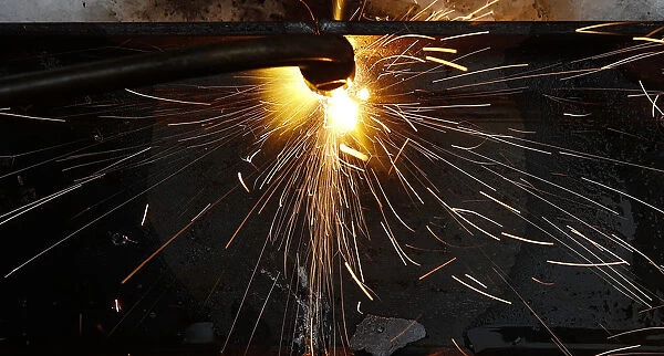 A metal construction is welded at the Ariel Metal steel trader warehouse in Podolsk