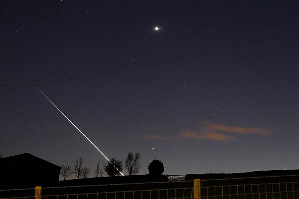 A meteorite creates a streak of light across the night sky over the North Yorkshire
