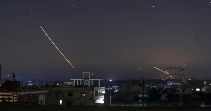 Framed Print : Missile fire is seen over Daraa