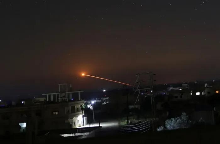 Framed Print : Missile fire is seen over Daraa