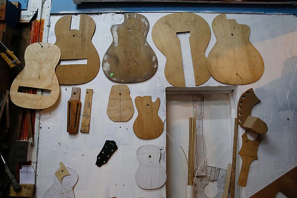 Molds for the manufacture of guitars, are displayed inside a workshop of instruments at