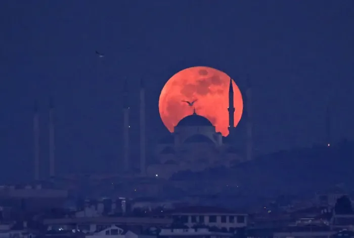 Framed Print : A full moon rises behind a mosque over the Camlica hill in Istanbul Framed Print : A full moon rises behind a mosque over the Camlica hill in Istanbul