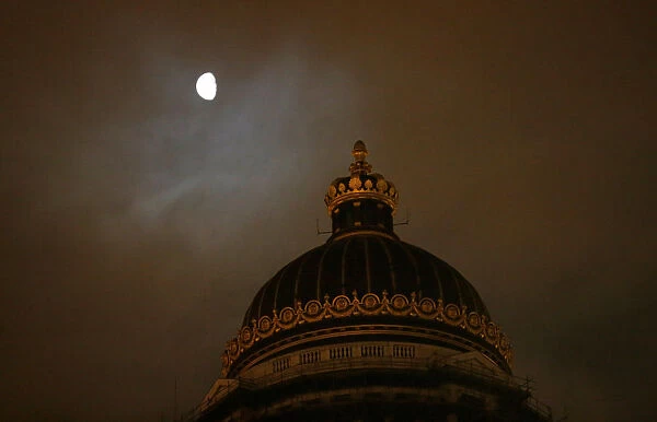 The moon is seen behind Brussels Palace of Justice, ahead of the trial of Salah Abdeslam