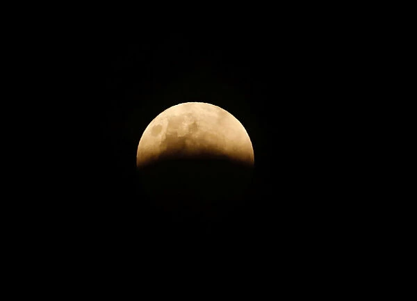 A full moon is seen during a lunar eclipse in Jakarta