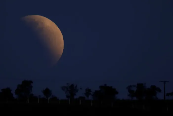 Framed Print : A moon is seen during a partial lunar eclipse in Brasilia