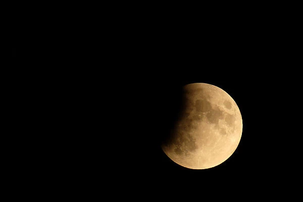 The moon is seen during a partial lunar eclipse in Venice