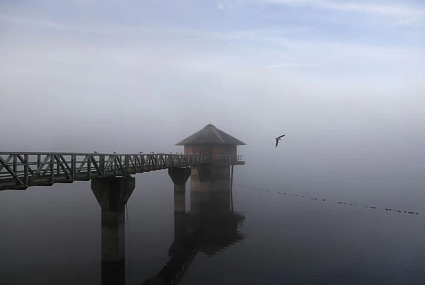 Morning mist sits over the Cropston Reservoir in Britain