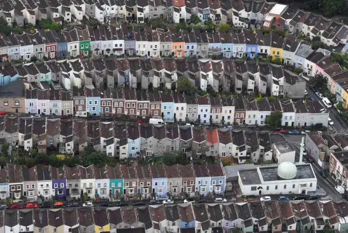 Framed Print : A mosque is seen amongst residential housing from the air during a mass take off