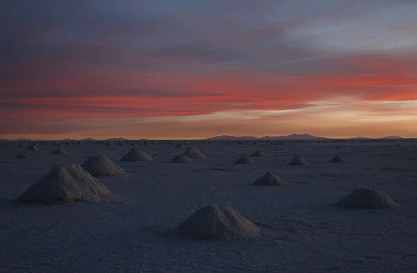 Mounds of salt formed by miners sit on the Salar de Uyuni, the worlds biggest salt desert