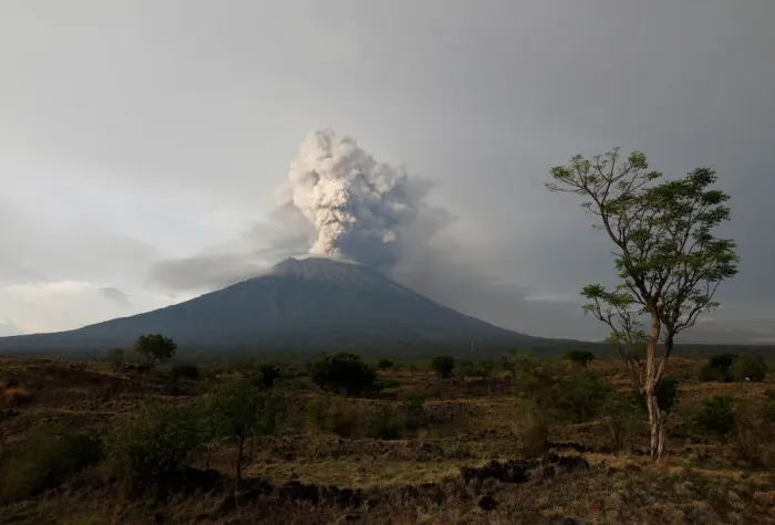Framed Print : Mount Agung volcano erupts as seen from Kubu