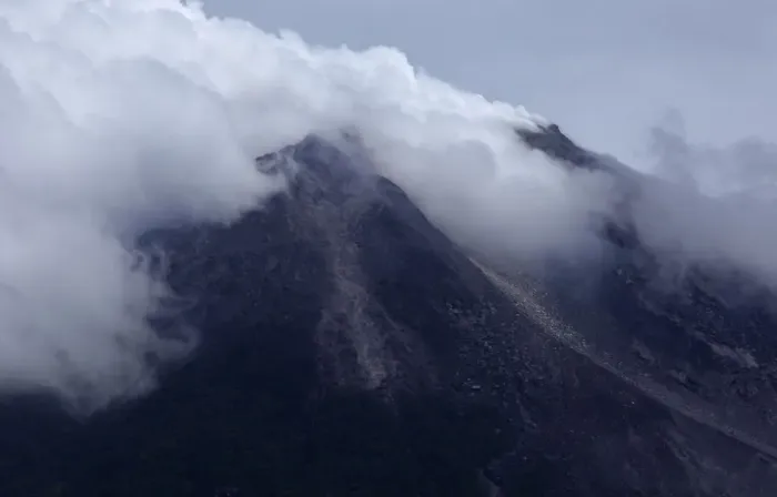 Framed Print : Mount Merapi volcano emits smoke as it is seen from Kinahrejo village near Yogyakarta Framed Print : Mount Merapi volcano emits smoke as it is seen from Kinahrejo village near Yogyakarta