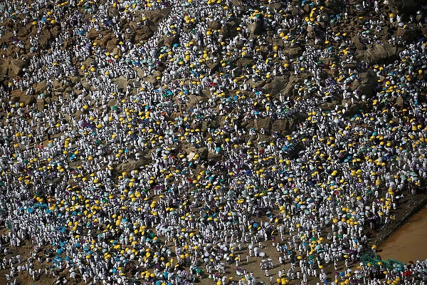 Muslim pilgrims gather on Mount Mercy on the plains of Arafat during the annual haj