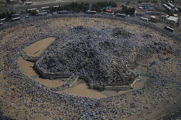 Muslim pilgrims gather on Mount Mercy on the plains of Arafat during the annual haj