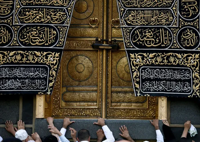 Framed Print : Muslims touch the Kaaba at the Grand Mosque during the holy fasting month of Ramadan in Framed Print : Muslims touch the Kaaba at the Grand Mosque during the holy fasting month of Ramadan in