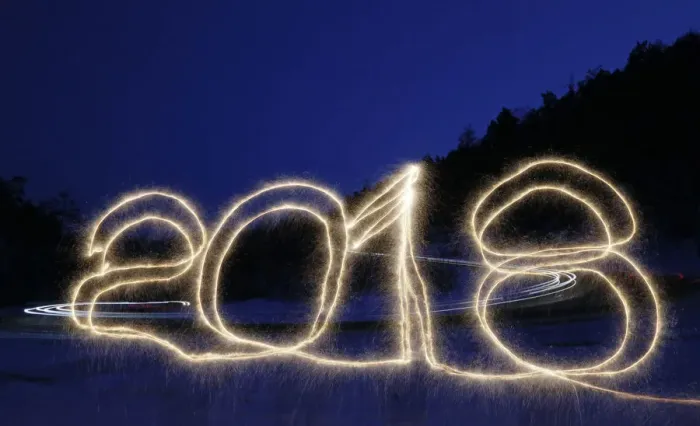 Framed Print : The numbers 2018 are written in the air with a sparkler on a roadside while cars drive Framed Print : The numbers 2018 are written in the air with a sparkler on a roadside while cars drive