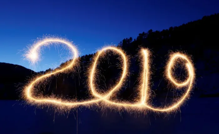 Framed Print : The numbers 2019 are written in the air with a sparkler near a tourist camp outside
