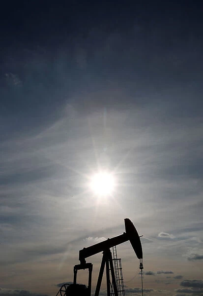 An oil pump is seen at sunset outside Vaudoy-en-Brie