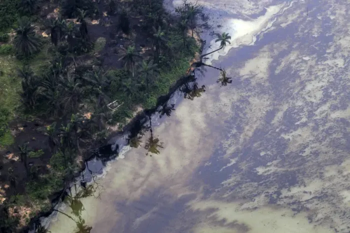 Framed Print : Oil surfaces on water near an illegal oil refinery in Ogoniland outside Port Harcourt in Framed Print : Oil surfaces on water near an illegal oil refinery in Ogoniland outside Port Harcourt in