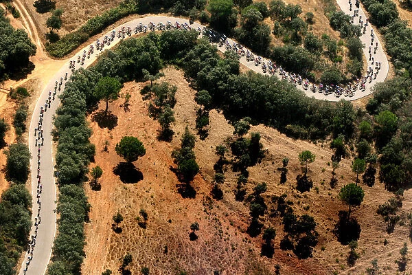 A pack of riders cycle during the third stage of the Tour of Spain cycling race between Cordoba
