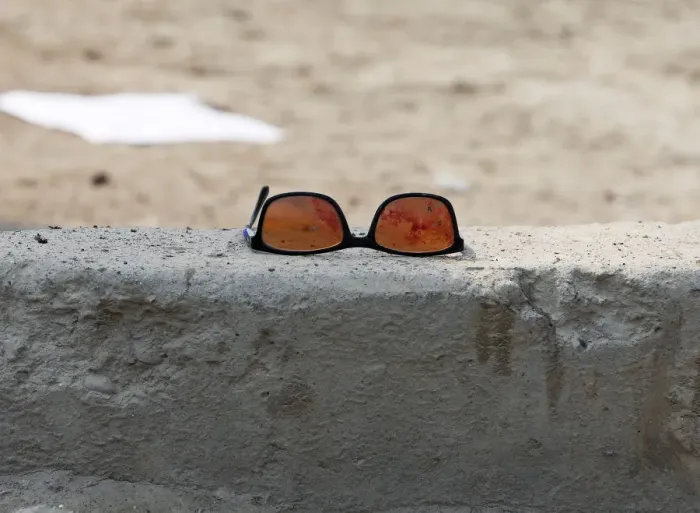 Framed Print : A pair of sunglass with blood is seen at the site of a suicide bomb attack near a Shi ite Framed Print : A pair of sunglass with blood is seen at the site of a suicide bomb attack near a Shi ite