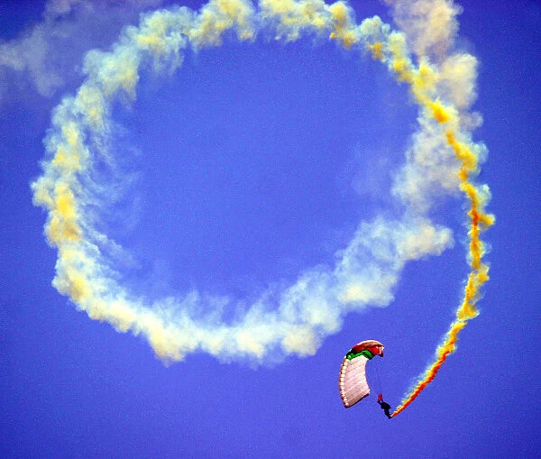 Pakistani paratrooper performs during a show to mark Defence Day in Lahore