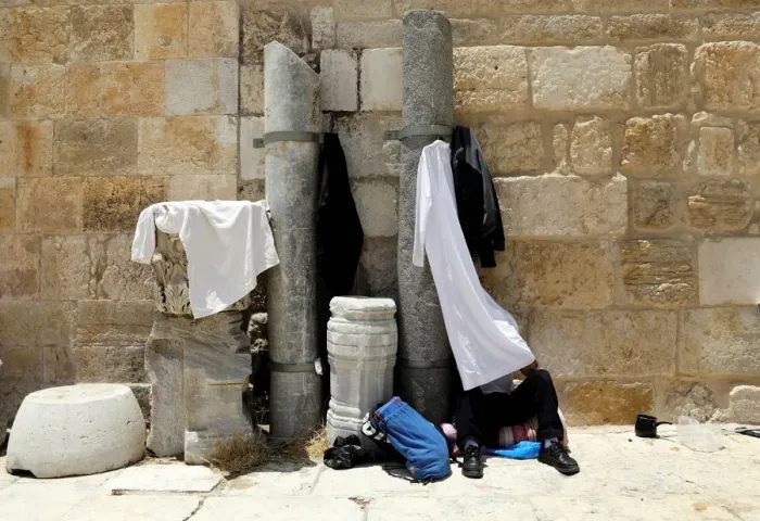 Framed Print : A Palestinian man reads the Koran in the compound known to Muslims as Noble Sanctuary Framed Print : A Palestinian man reads the Koran in the compound known to Muslims as Noble Sanctuary
