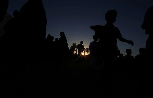 Palestinians arrive to attend Eid al-Fitr prayers in Khan Younis in the southern Gaza