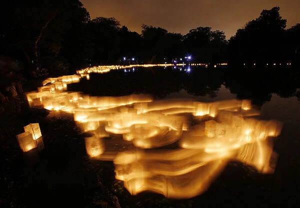 Paper lanterns float on Lake Hibiscus during the Forest Hills Lantern Festival at the