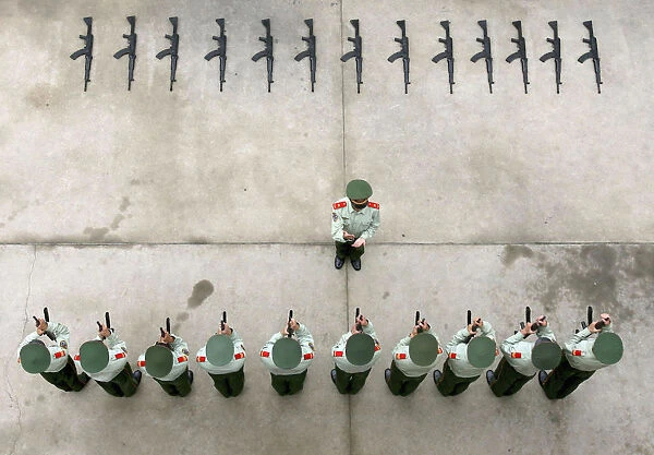 Paramilitary policemen of a national flag squad take part in a training session in