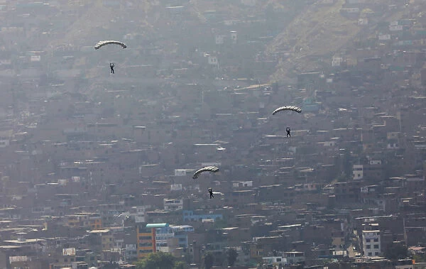Paratroopers perform during an earthquake drill at Rimac army headquarters in Lima