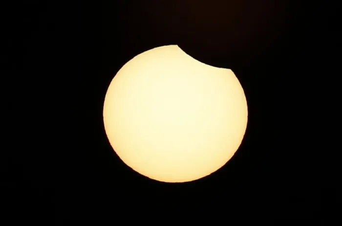 Framed Print : A partial solar eclipse is observed at Coquimbo