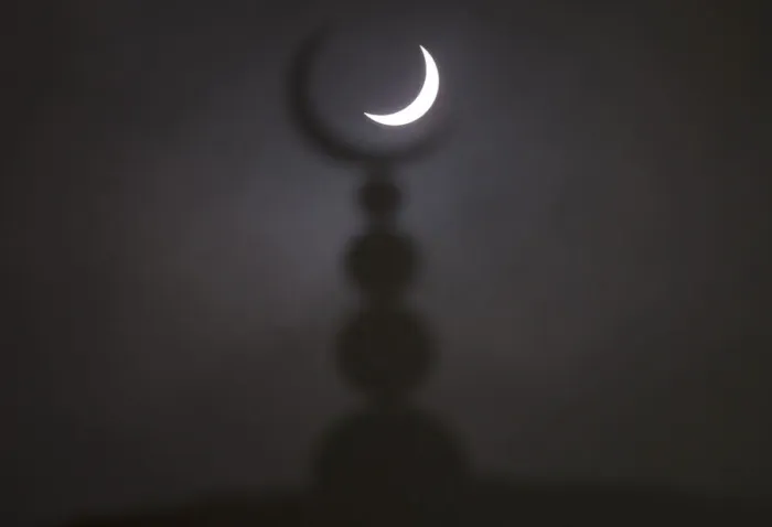 Framed Print : A partial solar eclipse in seen above a mosque in Oxford Framed Print : A partial solar eclipse in seen above a mosque in Oxford