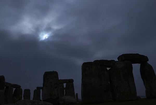 A partial solar eclipse is seen over Stonehenge in south west England
