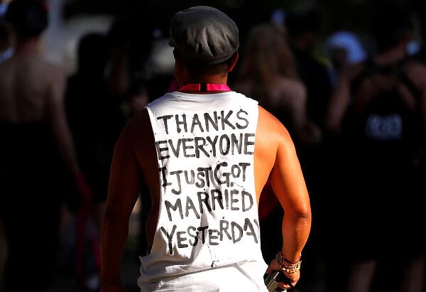 A participant wears a shirt bearing a message regarding same-sex marriage as he prepares