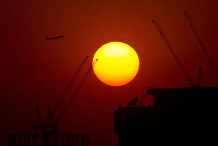 Framed Print : A passenger jet flies past the setting sun in Shanghai Framed Print : A passenger jet flies past the setting sun in Shanghai