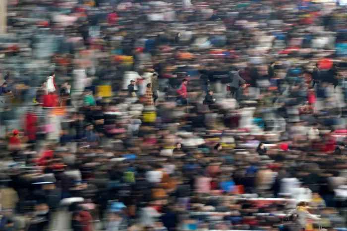 Framed Print : Passengers wait to board trains at Shanghais Hongqiao Railway Station as the annual