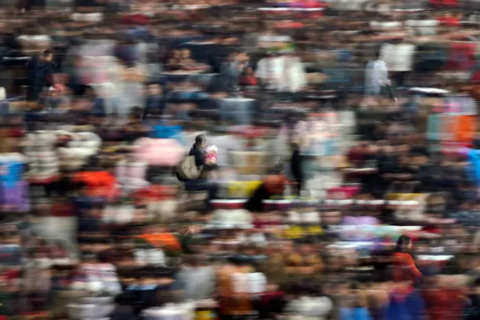 Framed Print : Passengers wait to board trains at Shanghais Hongqiao Railway Station as the annual Framed Print : Passengers wait to board trains at Shanghais Hongqiao Railway Station as the annual