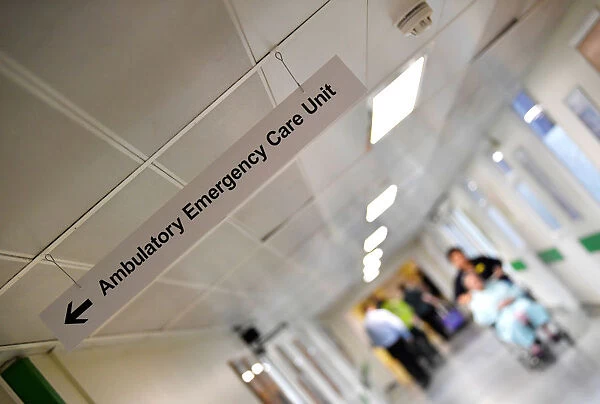 A patient is pushed down a corridor in Frimley Park Hospital near Camberley