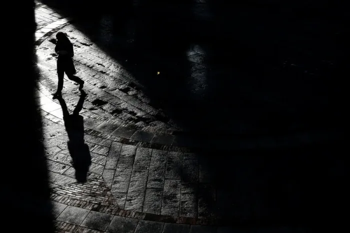 Framed Print : A pedestrian walks through Quincy Market on a warm winter afternoon in downtown in Boston Framed Print : A pedestrian walks through Quincy Market on a warm winter afternoon in downtown in Boston