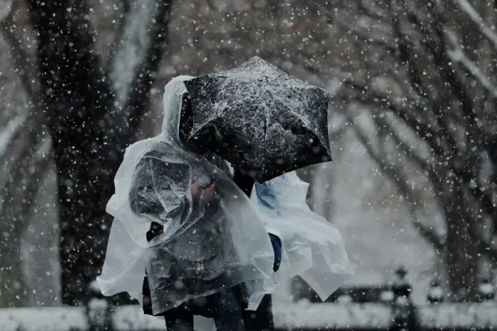 Framed Print : Pedestrians walk through Central Park during a snow storm in New York