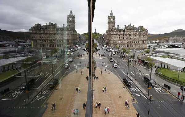 Pedestrians walk along Princes Street, the main shopping street in Edinburgh
