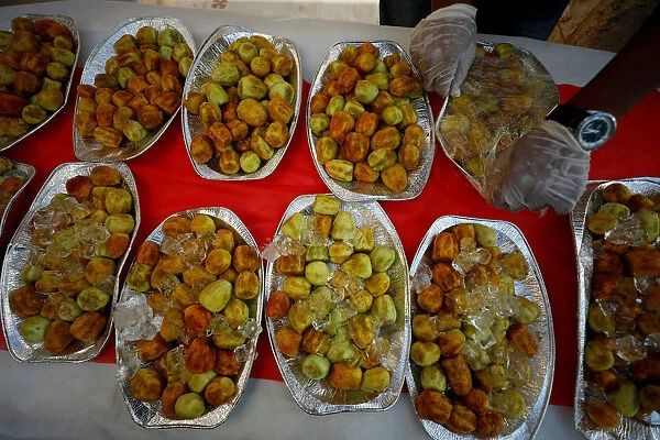 Peeled prickly pears are displayed for people to taste during a cactus fruits exhibition