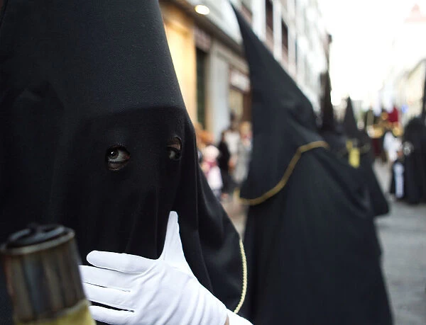 A penitent waits for the start of a procession in Tenerife in Spains Canary Islands