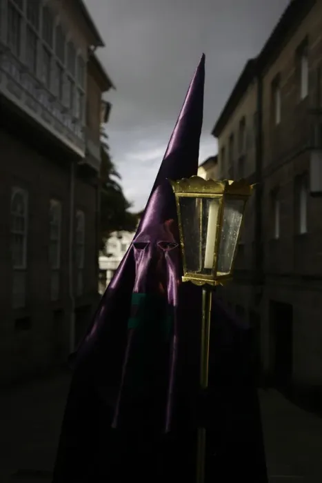 Framed Print : A penitent waits to start the procession of the Veracruz brotherhood during the Holy Framed Print : A penitent waits to start the procession of the Veracruz brotherhood during the Holy